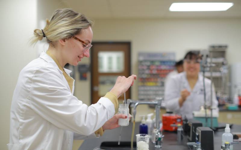 Female UToledo Pharmacy student in lab