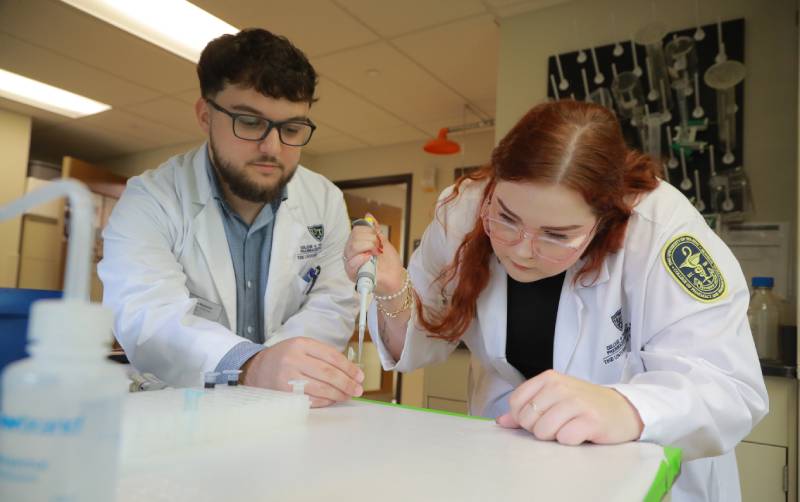 two UToledo pharmacy students in lab